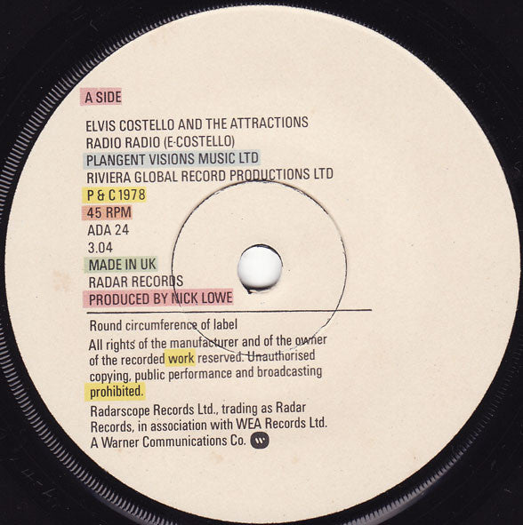 Elvis Costello And The Attractions* : Radio Radio (7", Single)